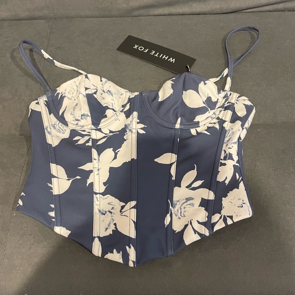 Brand new with tags. Xs blue and white corset top with back zipper.